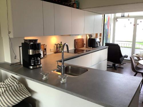 a kitchen with a sink and a counter top at 4 person holiday home in Lemvig in Lemvig