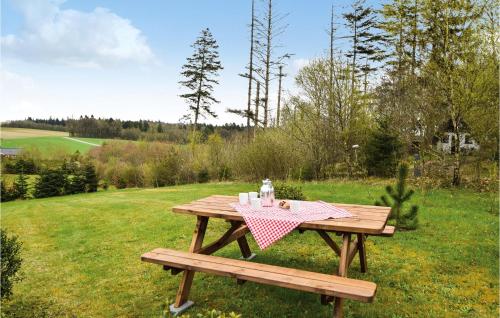 a picnic table with a napkin on it in a field at Holiday Home Rørbækvej Ejstrupholm Ii in Krejbjerg