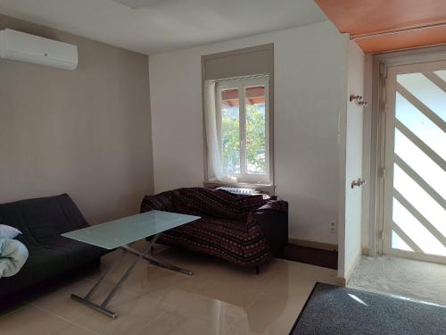 Posezení v ubytování Appartement 2 chambres riorges