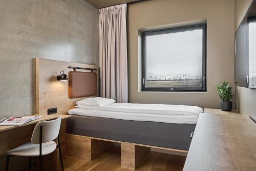 Postel nebo postele na pokoji v ubytování Smarthotel Bodø