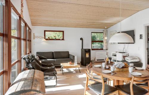 a living room with a couch and a table at 3 Bedroom Stunning Pet-Friendly Home In Stubbekøbing in Stubbekøbing