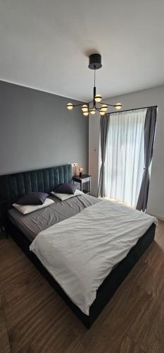 Ένα ή περισσότερα κρεβάτια σε δωμάτιο στο Cozy stay near Ialomita River