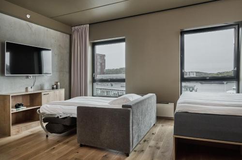 Postel nebo postele na pokoji v ubytování Smarthotel Bodø