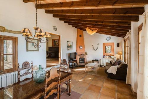 a large living room with a wooden ceiling at Casa Tramuntana in Valldemossa