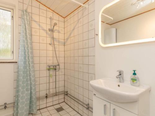 a bathroom with a shower and a sink at 6 person holiday home in Borup in Borup