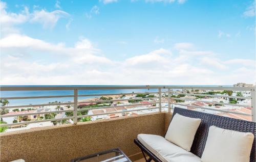 a balcony with a couch and a view of the ocean at Lovely Apartment In Torrevieja in Torrevieja