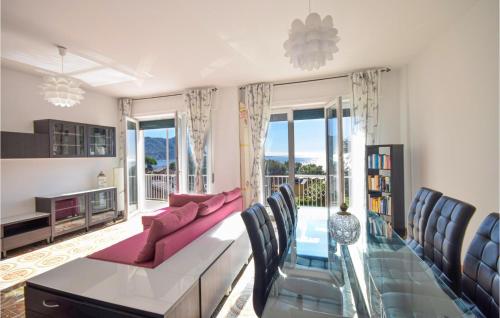 a living room with a couch and a table and chairs at Amazing Apartment In Recco With Kitchen in Recco