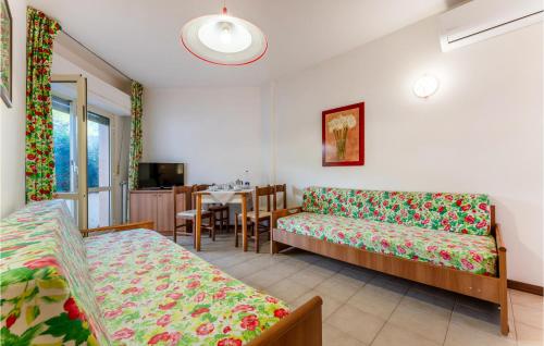 a living room with a couch and a table at Bilo 5 in Orbetello