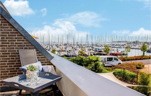 a balcony with a table and a view of a marina at Beautiful Apartment In Bruinisse in Bruinisse