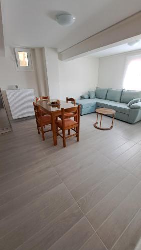 a living room with a couch and a table at Ανεμώνη Αράχωβα in Arachova