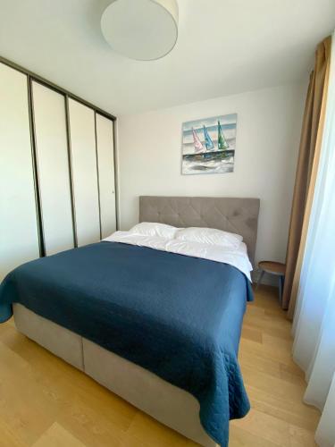 Ένα ή περισσότερα κρεβάτια σε δωμάτιο στο Danubius Apartments