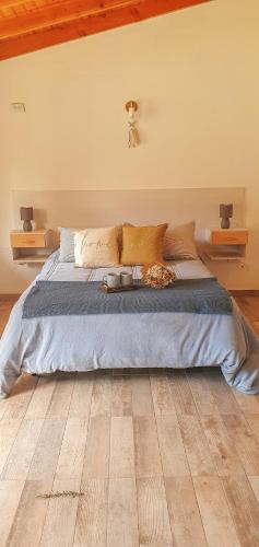 En eller flere senge i et værelse på Tierra Patagonica Departamentos