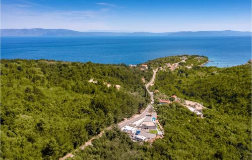 an aerial view of a house on a hill next to the ocean at Nice Home In Labin With Wifi in Labin