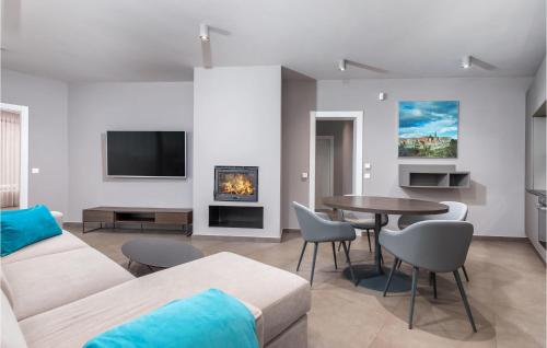a living room with a couch and a table at Nice Home In Labin With Wifi in Labin