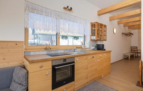 a kitchen with a sink and a window at Modernes Ferienhaus Guessing in Güssing