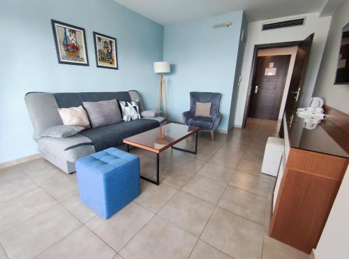 a living room with a couch and a table at Hotel & Spa Tino Sveti Stefan in Ohrid