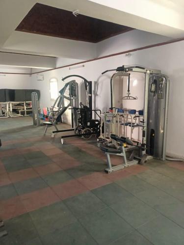 a room with a gym with machines in it at Dolphin Continental Hotel in Quseir
