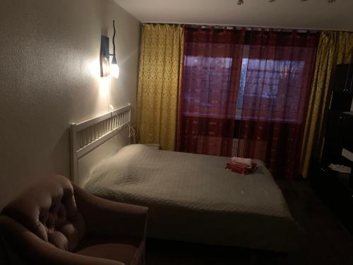 a small bedroom with a bed and a window at K76 - Very Nice 2-bedrooms Apartment -2 big beds-1 single bed in Tartu