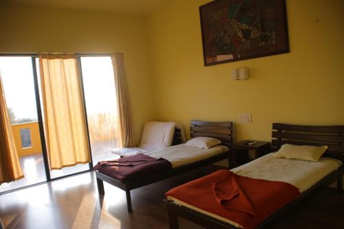 Ένα ή περισσότερα κρεβάτια σε δωμάτιο στο The Yellow Retreat