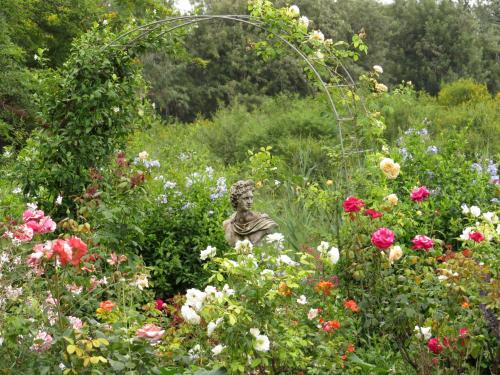 a statue in the middle of a field of flowers at Gerald's Gift Guest House in Addo