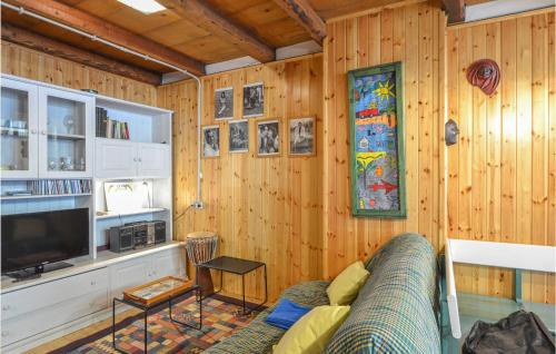 a living room with a couch and a stained glass window at 1 Bedroom Beautiful Home In Taipana in Taipana