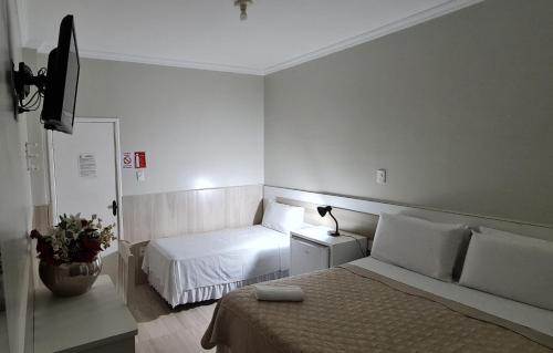 Katil atau katil-katil dalam bilik di Faixa Hotel