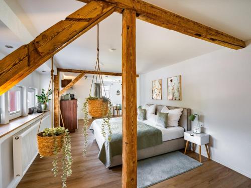 a bedroom with a swing bed in a room at Mainzauber Apartments Miltenberg in Miltenberg