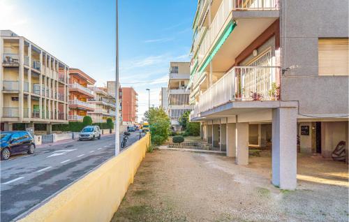 a city street with buildings and cars on the road at Awesome Apartment In Santa Pola in Santa Pola