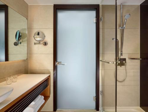 a bathroom with a shower and a sink at Park Plaza London Westminster Bridge in London