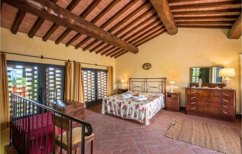 a bedroom with a bed and a wooden ceiling at Cozy Home In San Quirico Dorcia in San Quirico dʼOrcia