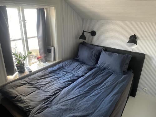 Postel nebo postele na pokoji v ubytování Båtmansstugan i Gamla Stan