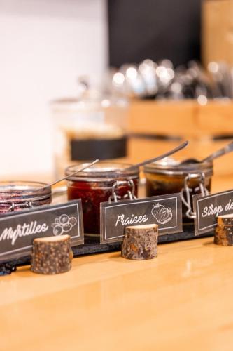a group of jars of jam on a table at Auberge de Jeunesse de La Roche - Champlon in Tenneville