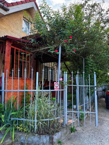 a fence in front of a house with a no parking sign at Casa Eni in Cluj-Napoca