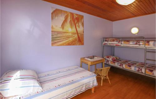 a bedroom with two bunk beds and a desk at Gorgeous Home In Aubenas in Aubenas