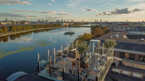 a view of a river with a city in the background at Central Penthouse with Private Rooftop Terrace in Copenhagen