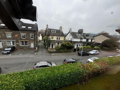 a group of cars parked in a parking lot at Dovera, private parking included, Bowness on Windermere in Bowness-on-Windermere