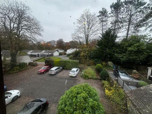 a group of cars parked in a parking lot at Dovera, private parking included, Bowness on Windermere in Bowness-on-Windermere
