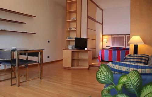 a living room with a couch and a table at Pràti Home in Rome