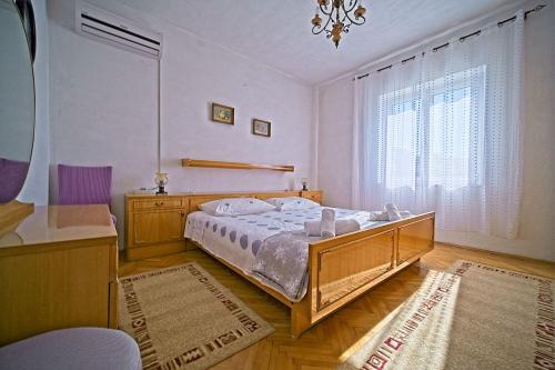 Ένα ή περισσότερα κρεβάτια σε δωμάτιο στο Apartment Pavo