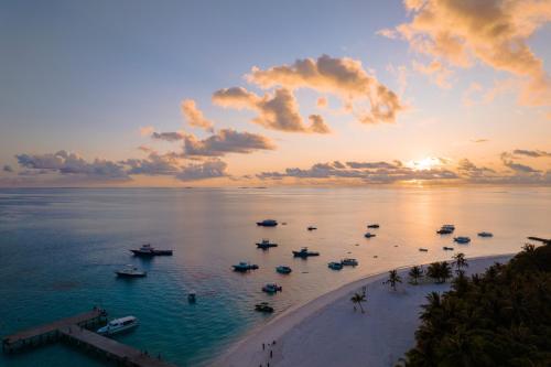 a view of a beach with boats in the water at Atoll Retreat in Fulidhoo