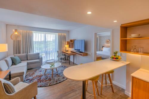 a living room with a couch and a table at Holiday Inn - Lusaka by IHG in Lusaka