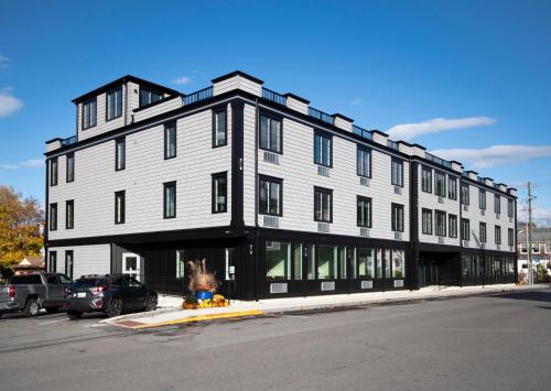 a large white building on a city street at The Pathmaker Hotel in Bar Harbor