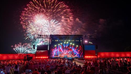 a crowd of people watching a concert with fireworks at Holiday Inn - Ottawa Dwtn - Parliament Hill by IHG in Ottawa