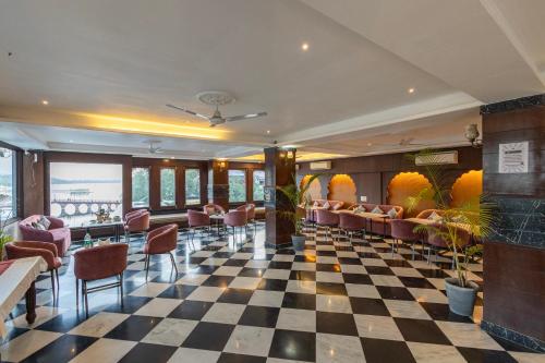 a lobby of a hotel with a checkered floor at Hide-In Udaipur - A Lake View Boutique Hotel in Udaipur