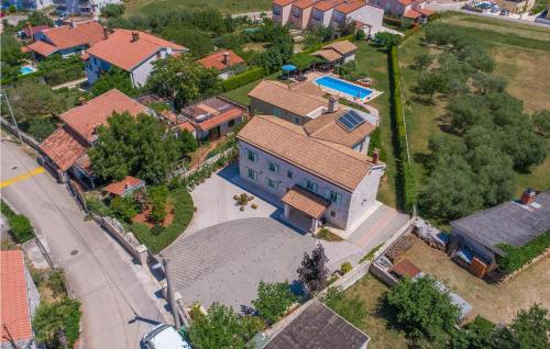 an overhead view of a house with a pool at Villa Judita in Tar