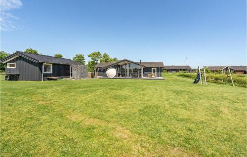 a house with a large yard in front of it at Holiday Home Rørbæksøvej Ejstrupholm X in Krejbjerg