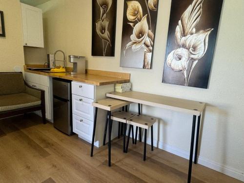 a kitchen with a counter and a table and chairs at Sun Cabin #3 Pahrump in Pahrump