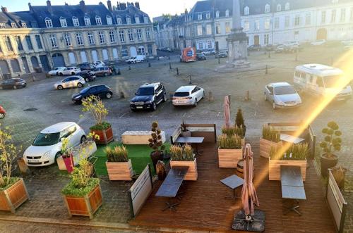 a view of a parking lot with parked cars at Maison arrageoise authentique, entre ville et parc in Arras
