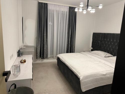 Ένα ή περισσότερα κρεβάτια σε δωμάτιο στο Penthouse Atmosphere Sebeş
