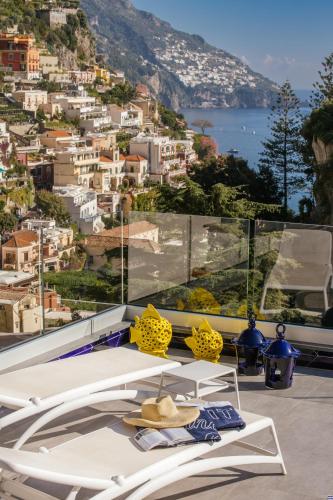 a balcony with a view of a city at Positamy in Positano